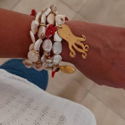 Multi strand bracelet with gold pendant