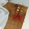Statement earrings with gold seahorses and red coral cluster