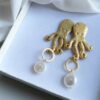 Octopus earrings with flat baroque pearls
