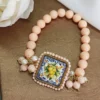 Bracciale siciliano con pietre rosa e mattonella in ceramica di caltagitone