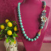 collana lunga siciliana con turchese aulite e fiore in ceramica di caltagirone