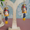 orecchini siciliani con teste di moro in ceramica di caltagirone lapis blu e agata gialla