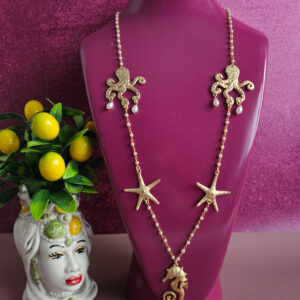 collana a catena rosario con perle e connettori oro stella marina polpo
